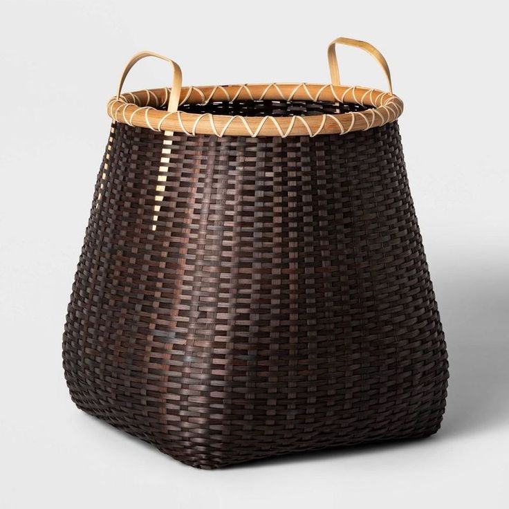 a brown basket with handles on it