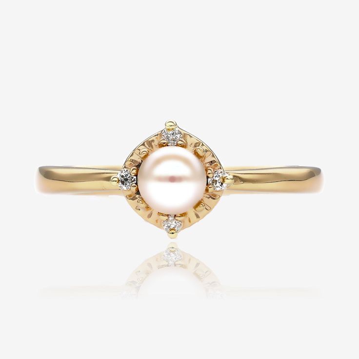 Sometimes simple and sweet is the most elegant choice. A gleaming cultured pearl measuring 4.5mm sits atop this lovely 14k yellow gold ring. Accented with four small round natural diamonds for a total diamond weight of 0.04ct. Elegant Gold Halo Pearl Ring, Delicate Yellow Gold Pearl Ring With Diamonds, Delicate Yellow Gold Pearl Ring, Elegant Yellow Gold Pearl Ring With Halo, Classic Yellow Gold Pearl Ring With Single Diamond, Classic Yellow Gold Pearl Ring With Diamond, Classic Gold Pearl Ring With Halo, Yellow Gold Pearl Ring With Single Diamond, Timeless Gold Pearl Ring With Diamond Accents