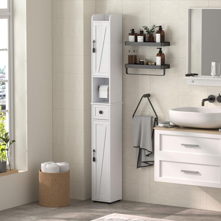 a bathroom with a sink, mirror and cabinet next to a window on the wall