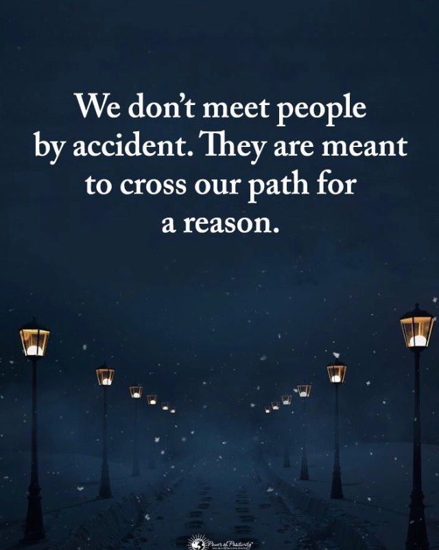 a dark street at night with the words we don't meet people by accident they are meant to cross our path for a reason