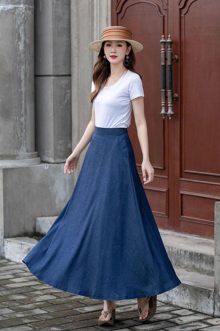 "Introducing our blue A-line high-waisted maxi skirt. This skirt is a timeless and versatile addition to your wardrobe. The A-line silhouette flatters every body shape, while the high-waisted design accentuates your waistline. Made from high-quality fabric, it offers a comfortable fit and effortless style. Whether you dress it up with a blouse and heels or go for a more casual look with a tucked-in t-shirt and sneakers, this skirt is perfect for any occasion. DETAILS: * Tencel blend * Two side pockets * Right zip closure * A litter Back elastic, comfortable wear * Plus size full skirt * Ankel length * Perfect for summer, autumn, spring * Dry clean MODEL SIZE Bust:85 cm(33.4\") Waist:67 cm(26.7\") Height 5'8\" (172cm) She wears size US 2 Choose CUSTOM Order if you * Need a better fit * Can' Non-stretch Maxi Skirt For Spring, Non-stretch Full Maxi Skirt, Fitted A-line Maxi Skirt For Spring, Elegant Full Length Summer Skirt, Spring Solid Color Long Maxi Skirt, Spring Maxi Dress With Lined Full Skirt, Spring Maxi Dress With Full Lined Skirt, Spring Wide Leg Pleated Maxi Dress, Spring Pleated Wide-leg Maxi Dress