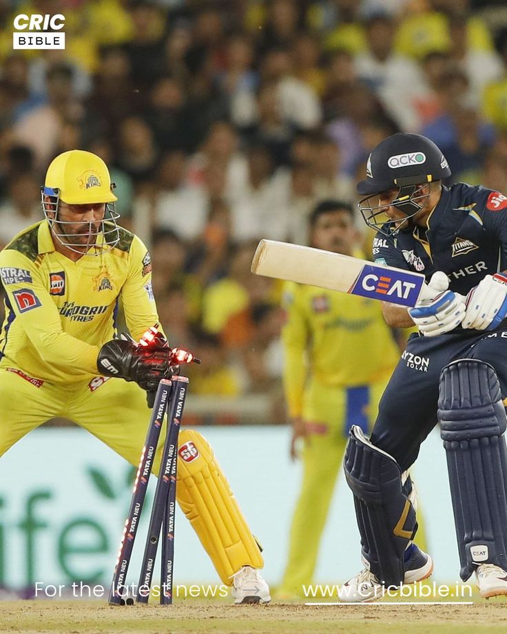 two men in yellow and blue uniforms playing cricket