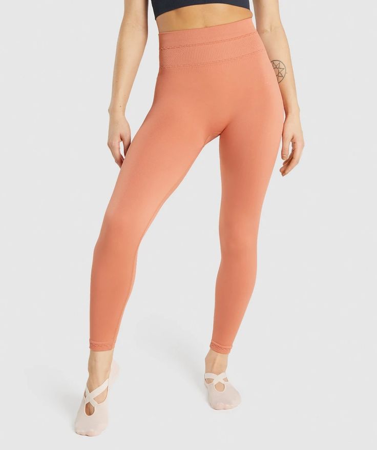 Gymshark Studio Leggings - Orange | Gymshark Solid Stretch Activewear With Seamless Construction, Solid Stretch Seamless Activewear, Seamless Stretch Solid Activewear, Solid Color Stretch Seamless Activewear, Solid Color Seamless Stretch Activewear, Versatile Solid Stretch Activewear, Versatile Solid Activewear With Stretch, Stretch Nylon Activewear, 4-way Stretch Seamless Tights For Training