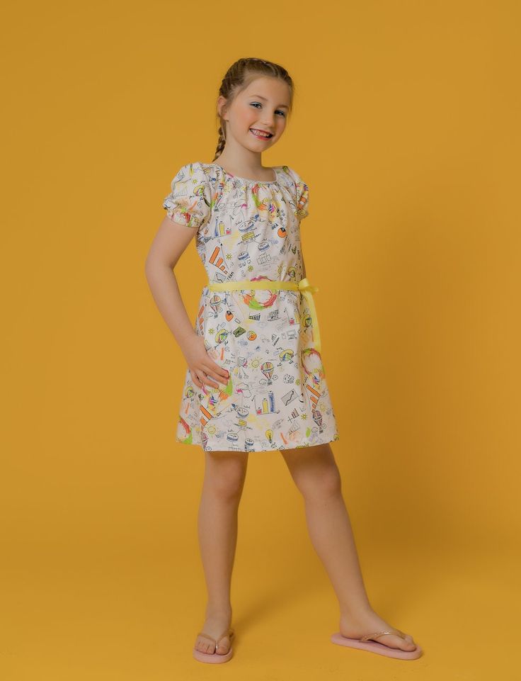 She'll love slipping into this playful A-line dress cut from 100% breathable cotton. It has an A-Line bodice, side pockets, wide round neck, puff-sleeve with elastic cuff and single button opening at the back.  Get free shipping when you spend $100 or more at www.raebenson.com 100 % Cotton Machine Wash Cold Imported Style G1104 Cute Summer Dresses For Dress-up Occasions, Summer Cotton A-line Floral Dress, Fitted Short Sleeve Puff Sleeve Dress, Playful Printed Spring Dress, Playful Spring Printed Dress, Casual Multicolor Puff Sleeve Dress For Spring, Multicolor Casual Puff Sleeve Dress For Summer, Playful Cotton Mini Dress For Summer, Playful Summer Mini Dress