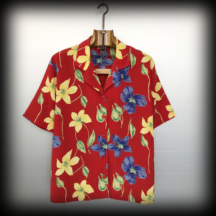 Vibrant Red Hawaiian Shirt with big bright flowers Material is polyester Condition is : mint vintage condition Size is FR 42 WOMEN (refer to measurements) This one is a women's shirt but it can easily fit men in size M Do not hesitate to DM if you have any questions ! shoulder seam to shoulder seam : 43cm / 16,9in Armpit to armpit : 53cm / 20,9in Sleeve (shoulder seam to bottom) : 26cm / 10,2in Front length (collar to bottom) : 45cm /17,7in Back length : 70cm / 27,5in Collared Tops With Hibiscus Print For Spring, Collared Hibiscus Print Top For Spring, Spring Collared Shirt With Hibiscus Print, Spring Hibiscus Print Collared Shirt, Spring Hibiscus Print Button-up Shirt, Spring Button-up Shirt With Hibiscus Print, Spring Collared Camp Shirt With Hibiscus Print, Red Camp Collar Top For Summer, Spring Hawaiian Shirt With Floral Print