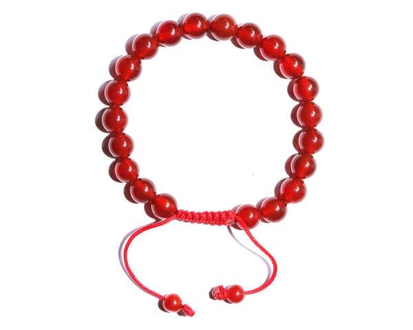 Best quality Tibetan Carnelian stone Buddhist bracelet. Hand strung with an adjustable knot, made in our Namaste Beads Handicrafts workshop in Kathmandu, Nepal. Beads : 21 Size : 8mm Weight : 18g Diameter : 2.4 inch We use a strong cord in different colors. If you need an specific color on your string, just inform us and we will be glad to made it. Adjustable Red Agate Beaded Bracelets, Red Agate Adjustable Beaded Bracelets, Adjustable Red Agate Beaded Bracelet, Adjustable Red Agate Crystal Bracelet, Adjustable Carnelian Beaded Bracelets For Meditation, Adjustable Carnelian Bracelet As A Gift, Adjustable Carnelian Bracelet Perfect For Gifts, Adjustable Carnelian Beaded Bracelets As Gift, Adjustable Carnelian Beaded Bracelet For Healing