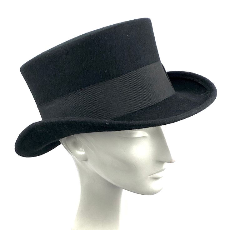 Edwardian top hat. You can make your hat with your favorite color by choosing it from my Wool felt color card. Made with short crown and embellished with a 50 millimeters wide grosgrain ribbon. Edwardian top hat ideal for everyday and special ocasions such as weddings, cocktails or parties. For man and woman. Measurements in centimeters are 32 x 27. Crown height 11. Brim length 6. These measurements may have some slight variation depending on the size of the hat. The end of the brim is reinforce Vintage Solid Felt Hat For Winter, Classic Winter Costume Hats And Headpieces, Classic Black Wide Brim Costume Hat, Classic Wide Brim Winter Costume Hats And Headpieces, Classic Fitted Winter Costume Hats And Headpieces, Classic Wide Brim Winter Costume Hat, Fitted Black Top Hat With High Crown, Fitted Formal Flat Cap Felt Hat, Vintage Top Hat With Flat Brim