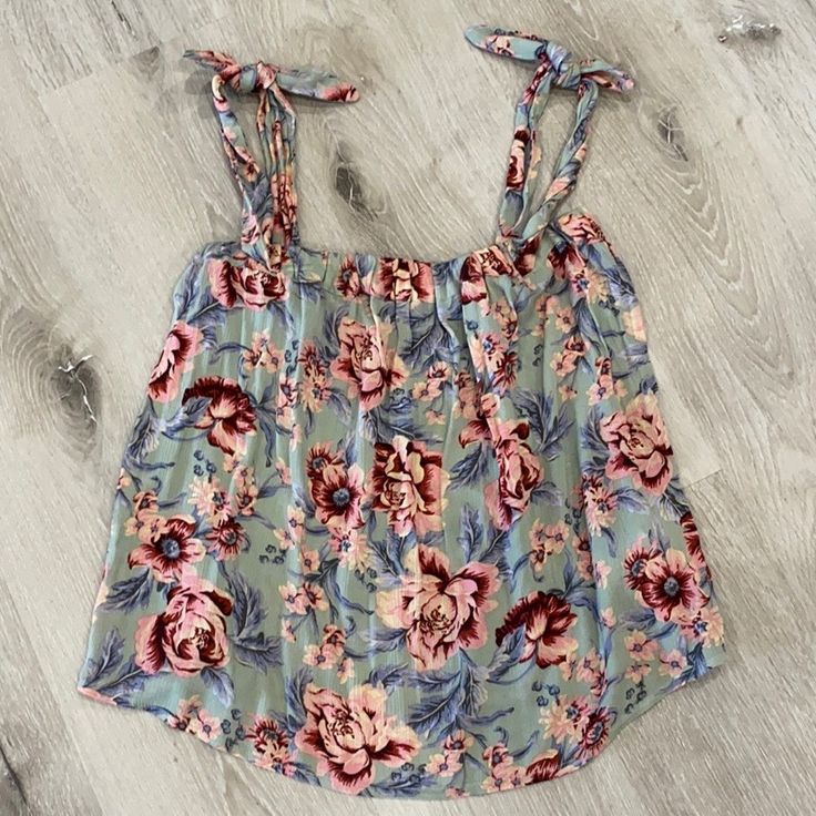 Nwt American Eagle Can Be Worn As A Tie Top Or Off Shoulder Pink And Mint Blue Floral Size Small No Trades *** I Will Not Negotiate In Comments Section. If You Make An Offer In The Comments Section I Will Ignore It. If You Would Like To Negotiate A Price Please Do So Under The Offer Button. Thanks For Understanding*** Casual Multicolor Floral Tank Top, Casual Multicolor Floral Print Tank Top, Casual Pink Tank Top With Floral Print, Cute Floral Print Tank Top For Day Out, Casual Pink Floral Print Tank Top, Feminine Blue Tops For Vacation, Blue Feminine Beach Top, Feminine Blue Beach Top, Light Blue Floral Print Vacation Tops