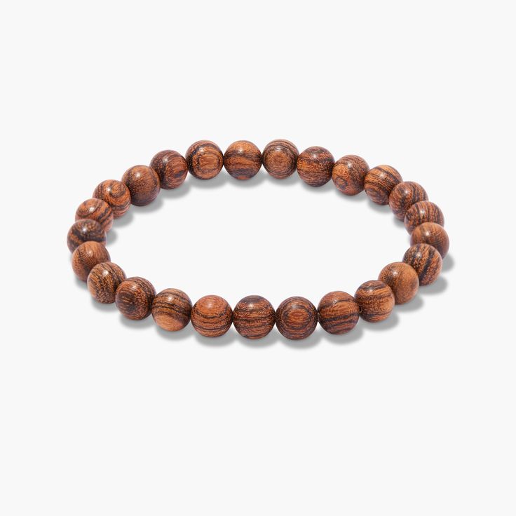 Crafted with care, our Rowan Bead Bracelet offers an eye-catching accent to any outfit. This stylish accessory is sure to make a statement and add a touch of sophistication to any man's look. Made from durable beads, this bracelet is designed to last. Showcase your sense of style and show the world who you are. Do you dare to be bold? Available in Tigerwood Bead 8" bead bracelet SKU: BYMB013 Casual Brown Beaded Bangle Bracelets, Meditation Brown Bracelet With Polished Beads, Classic Brown Bangle Bracelets, Everyday Wooden Beads Bracelets, Casual Everyday Bracelets With Large Beads, Casual Large Beads Bracelets For Everyday, Casual Brown Bracelets With Large Beads, Everyday Stretch Bracelet With Round Beads, Brown 8mm Beads Bracelets For Everyday