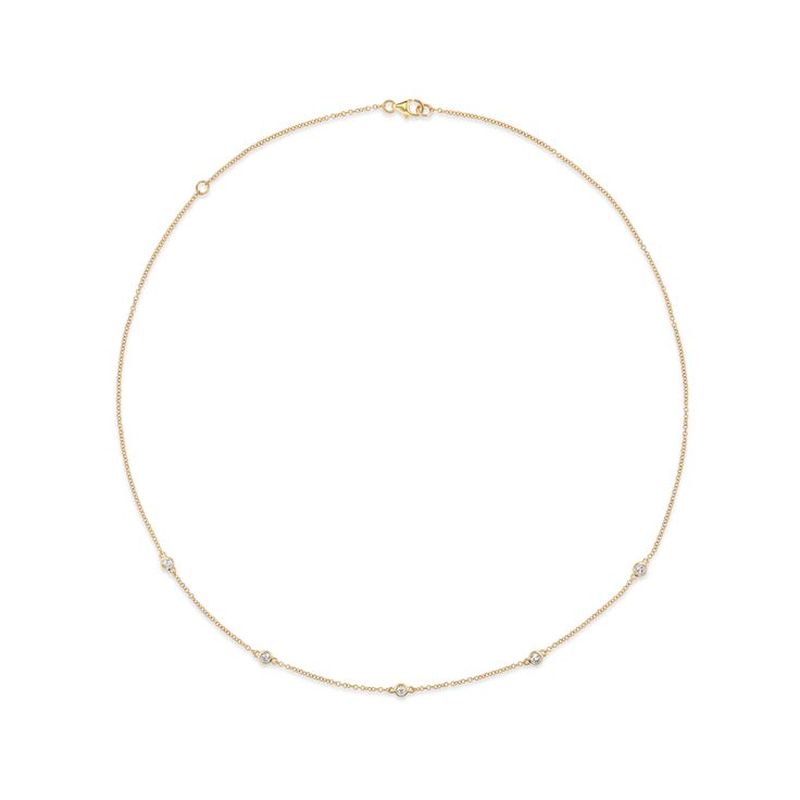 This beautiful and simple necklace, often referred to as a style called Diamonds by the Yard, features diamonds set into bezels along the necklace chain. Its shorter length sits just above the collar bone, begging to be seen. 14k yellow gold Five 2mm diamonds Option to clasp the chain at a 15 or 17 inch length This necklace can be made in a custom length, please email info@fewerfiner.com for pricing Please allow 4-6 weeks for production if the piece is described as "made to order," as this piece Elegant Bezel Set Station Necklace, Elegant Bezel Setting Station Necklace, Classic Formal Diamond Necklace With Adjustable Chain, Classic Diamond Necklace With Adjustable Chain For Formal Occasions, Luxury Diamond Station Necklace With Delicate Chain, Classic Diamond White Necklace With Delicate Chain, Classic Diamond White Jewelry With Adjustable Chain, Classic Diamond Necklace With Delicate Chain For Everyday Luxury, Classic Diamond Chain Necklace With Delicate Chain