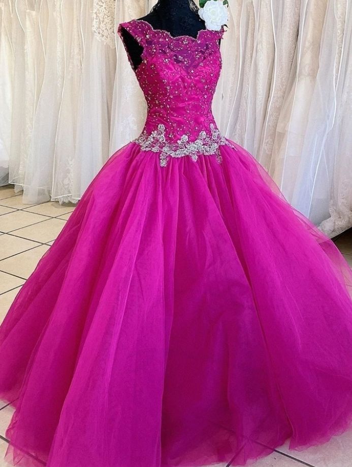 Ruby Outfit Elegant Fuchsia Tulle Formal Long Ball Gown, Appliques Evening DressA beautiful dress that brings plenty of shine, turn the wow factor all the way up in this custom made sparkly beaded sweetheart neckline chiffon homecoming dress. This gorgeous dress with a sweetheart neckline accentuates your bust line and the bodice is adorned with dazzling beading that shines from every angle. To so.. Fitted Embellished Evening Dress For Quinceanera, Fitted Pink Quinceanera Dress For Party, Elegant Purple Quinceanera Dress For Party, Elegant Purple Quinceanera Party Dress, Princess Style Embellished Floor-length Dress, Floor-length Princess Style Embellished Dress, Elegant Rhinestone Gown For Quinceanera, Elegant Quinceanera Gown With Rhinestones, Elegant Embellished Fitted Quinceanera Dress