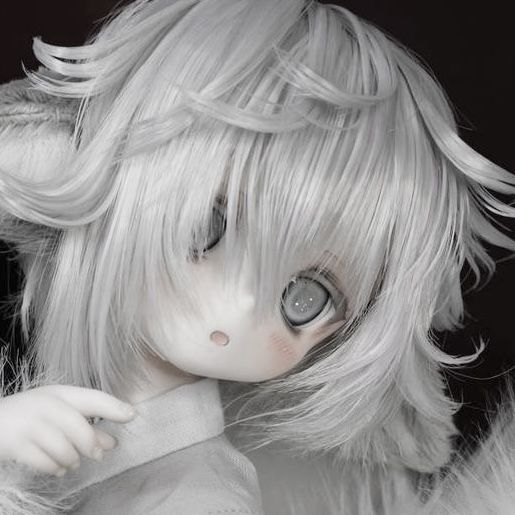 a doll with white hair and blue eyes is posing for the camera in front of a black background