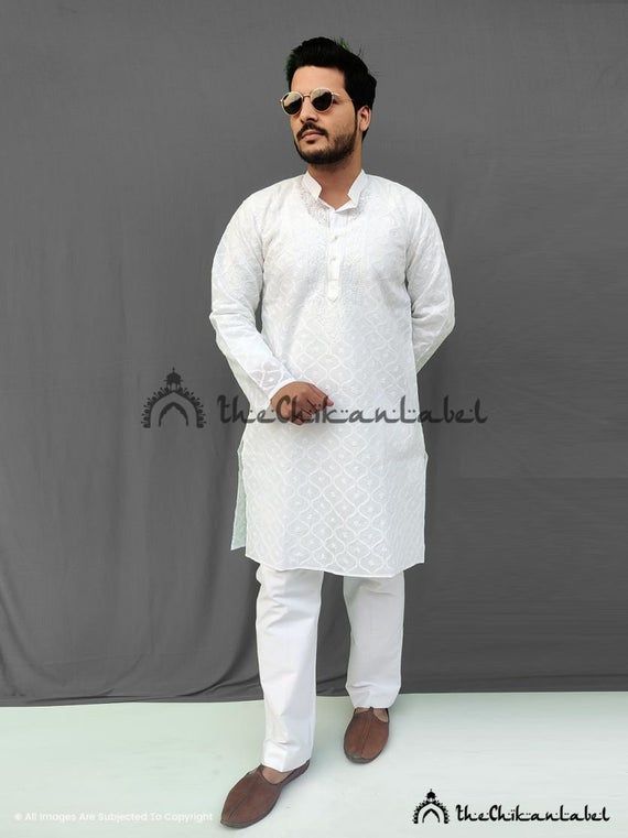 Mens kurta pajama set white mens kurta pyjama Ethnic wear kurtaDisclaimer : : Motifs of embroidery may vary as the images shown are for illustration purpose.PRODUCT SPECIFICATIONSFabric : CottonSleeves : Full SleevesCollar : Mandarian CollarWork : JaalKurta Length : 36-38 InchesOccasions : Party Wear, Festive WearGarment Care : Hand Wash OnlyPrice Includes : Kurta + PajamaPRODUCT FEATURESFlawless finishingElegant looksAlluring patternsSoft and Skin friendlyBest for summersTrivia: Chikankari is a Casual Kurta With Dabka For Festivals, Casual Dabka Kurta For Festivals, White Dabka Sherwani Traditional Fit, Casual Dabka Sets For Eid, Casual White Cotton Lawn Suit, Casual Unstitched Kurta With Chikankari Embroidery, Festive Casual Salwar Kameez With Dabka, White Kurta With Naqshi For Eid, Traditional Fit White Sherwani With Long Sleeves