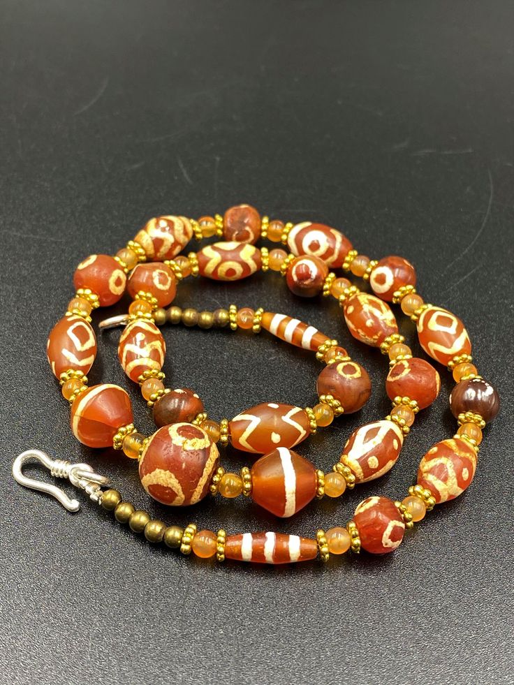 A Beautiful Etched Carnelian Beads Necklace Mala Every Bead In the Necklace Is Beautifully Etched With Rare and Unique Pattern Fast and Free Shipping Service Enjoy Orange Beaded Amulet Necklace, Large Oval Orange Beads, Large Orange Beads For Jewelry Making, Orange Large Beads For Jewelry Making, Orange Amulet Style Beaded Necklace With Polished Beads, Orange Large Beads For Spiritual Use, Amber Beaded Necklaces With Large Oval Beads, Amber Beaded Necklace With Large Oval Beads, Carnelian Colorful Beads For Jewelry Making