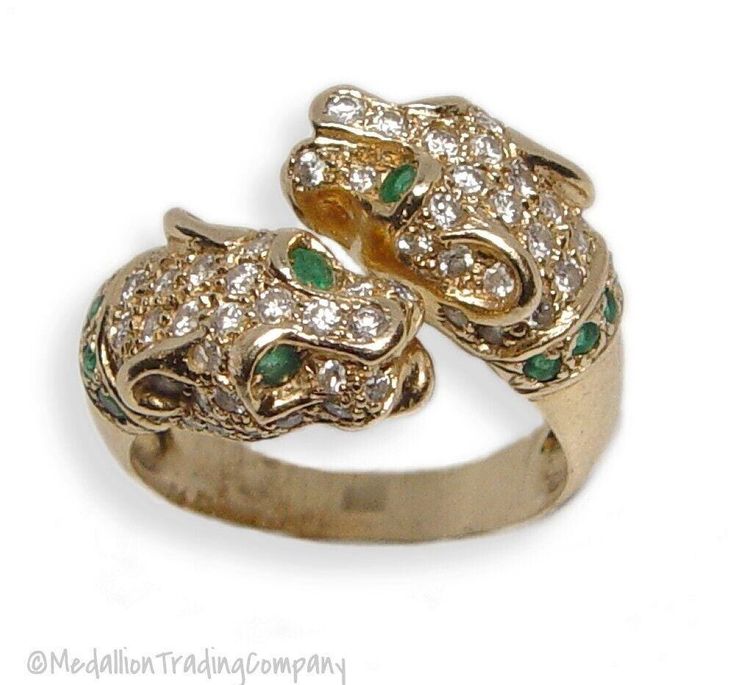 Medallion Trading Company   14K YELLOW GOLD  PANTHER RING WITH DIAMONDS & EMERALDS- SIZE 6.5   Condition: Excellent pre-owned condition. Professionally cleaned and polished Weight: 7.88 grams Size: 6.5 Measurements: The ring is approximately 16 mm (north to south)  Markings: 585 Diamonds: (66) natural round cut diamonds estimated at .01 carats each with a clarity of VS1 and color of G Gemstones: (14) natural round cut emeralds approximately .02-.03 carats each with good vivid color and excellent clarity     Q: What payments do you accept? A: We take Paypal, Visa, Mastercard, American Express and Discover.     Q: What countries do you ship to? A: We ship internationally, so please see the pull down box under the 'Shipping and Payments' tab at the top of this listing to find your country's s Panther Ring, Wrap Ring, Vivid Color, Trading Company, Wrap Rings, Round Cut Diamond, Jewellery And Watches, Panther, Round Cut