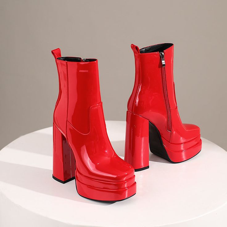 Introducing our newest arrivals ââ‚?the Red Platform Boots! A chic and stylish twist on the classic platform boot. these square-toe beauties are perfect for making a statement. The lush patent leather and chunky block heel add a touch of luxury. while the green hue is perfect for standing out from the crowd. Upper: Patent Leather Lining: Short Plush Outsole: Rubber Toe: Square Toe Closure: Zip Heel: 14cm/5.5'' Platform: 4cm/1.5'' Shaft: 13.5cm/5.3'' Circumference: 25cm/9.8'' Color: Green. Black. Trendy Polyurethane Boots With Block Heel, Trendy Polyurethane Block Heel Boots, Winter Square Toe Platform Boots, Bold Ankle Platform Boots For Fall, Chic Platform Boots In Polyurethane, Trendy Patent Leather Heeled Boots For Spring, Trendy Spring Patent Leather Heeled Boots, Spring Trendy Patent Leather Heeled Boots, Chic Glossy Finish Boots For Parties