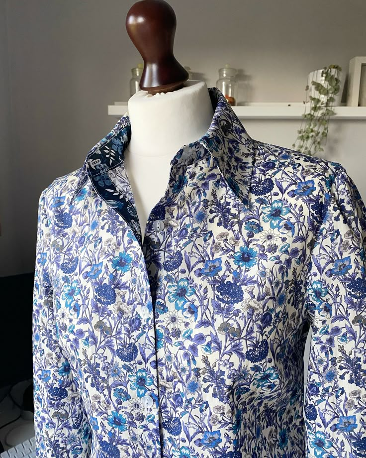 "Hand made Liberty of London floral print Tana Lawn collar shirt with long sleeves contrast collar stand and placket, Laurel Blouse. The Laurel blouse is a simple loose fitting blouse in beautiful liberty print cotton fabric with a Pointed collar and button through front. Inner collar band and placket are made with a contrasting liberty print. Let me know if you are happy for me to choose or if you would like to pick one yourself. Different prints are available so if you see one you would like o Elegant Shirt With Floral Print And Spread Collar, Spring Collared Blouse With Placket, Spring Blouse With Placket And Fold Down Collar, Elegant Long Sleeve Floral Print Shirt, Elegant Blouse With Floral Print And Spread Collar, Classic Long Sleeve Blouse With Floral Print, Classic Long Sleeve Floral Print Blouse, Printed Button-up Office Shirt, Blue Collar Top With Floral Print