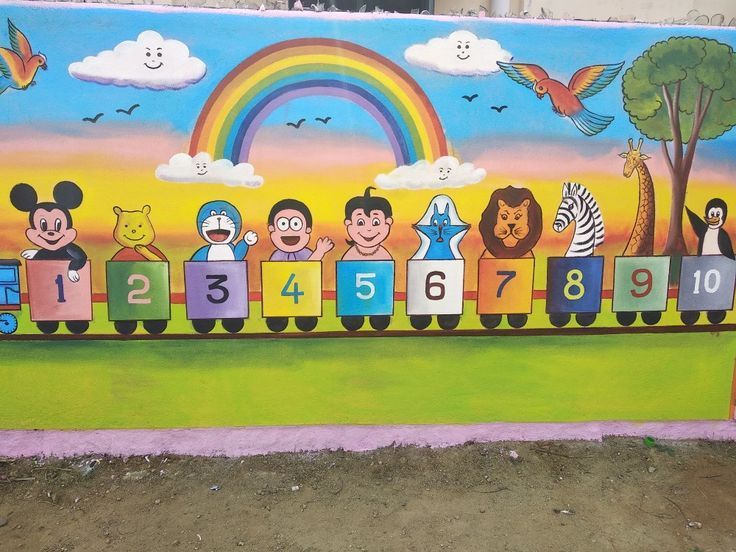 a mural painted on the side of a building with children's faces and numbers