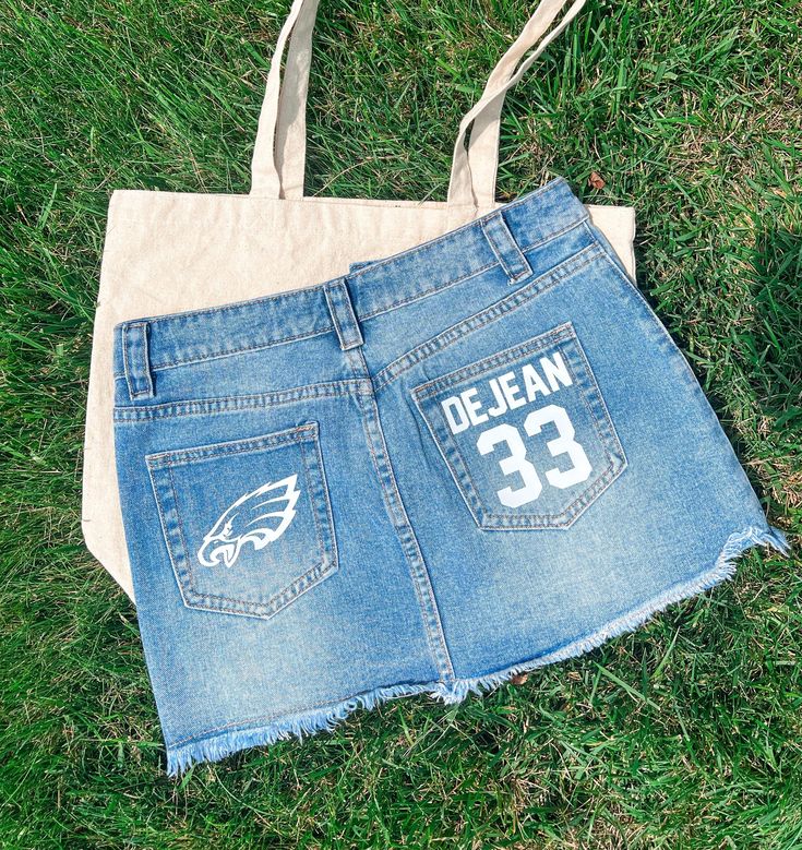 Our custom denim/jean skirt for YOUR closet's college gameday tailgate apparel!  SKIRTS INFO: - Denim skirts are made to order! In the personalization box, please list your logo that you would like and your color. Please message separately for a digital markup request. Unique designs may take longer to create and ship out. - Runs slightly smaller! - Please feel free to message with any questions or concerns! AFTER PURCHASING: - Shipping usually does not take very long. Our processing time is set College Gameday, Custom Denim, Denim Jean Skirt, Painted Jeans, Custom Football, Patchwork Jeans, Denim Skirts, Sports Games, Jeans Rock