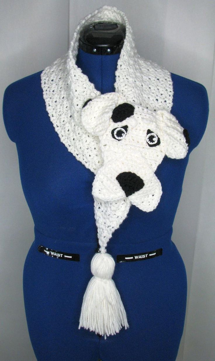 a mannequin wearing a white and black dog scarf