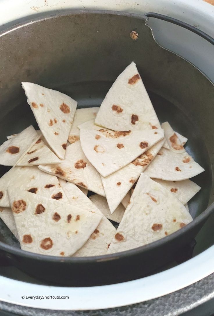 some tortilla chips are in a pot