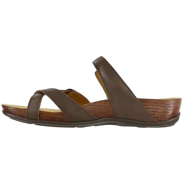 Start tab labels Description Details Start tab content This slip-on sandal has a leather toe-loop and adjustable features including an elasticized buckle across the in-step. A contoured insole supports the natural arch of the foot. Fine leather straps wrap around the base with a hand-polished wood effect, giving this sandal a stylish flair. Heel Height: 1.625". A fun slip-on sandal with a leather strap toe-post and unique adjustable features. Fine leather straps wrap around a base with a hand-po Brown Slip-on Footbed Sandals With Arch Support, Brown Slides With Cork-bed Midsoles And Single Toe Strap, Brown Open Toe Slides With Arch Support, Adjustable Brown Footbed Sandals With Ortholite Insole, Brown Toe Loop Footbed Sandals For Spring, Brown Double Strap Footbed Sandals With Leather Sole, Brown Slide Footbed Sandals With Removable Insole, Leather Toe Loop Footbed Sandals With Arch Support, Adjustable Brown Toe Ring Sandals With Leather Footbed