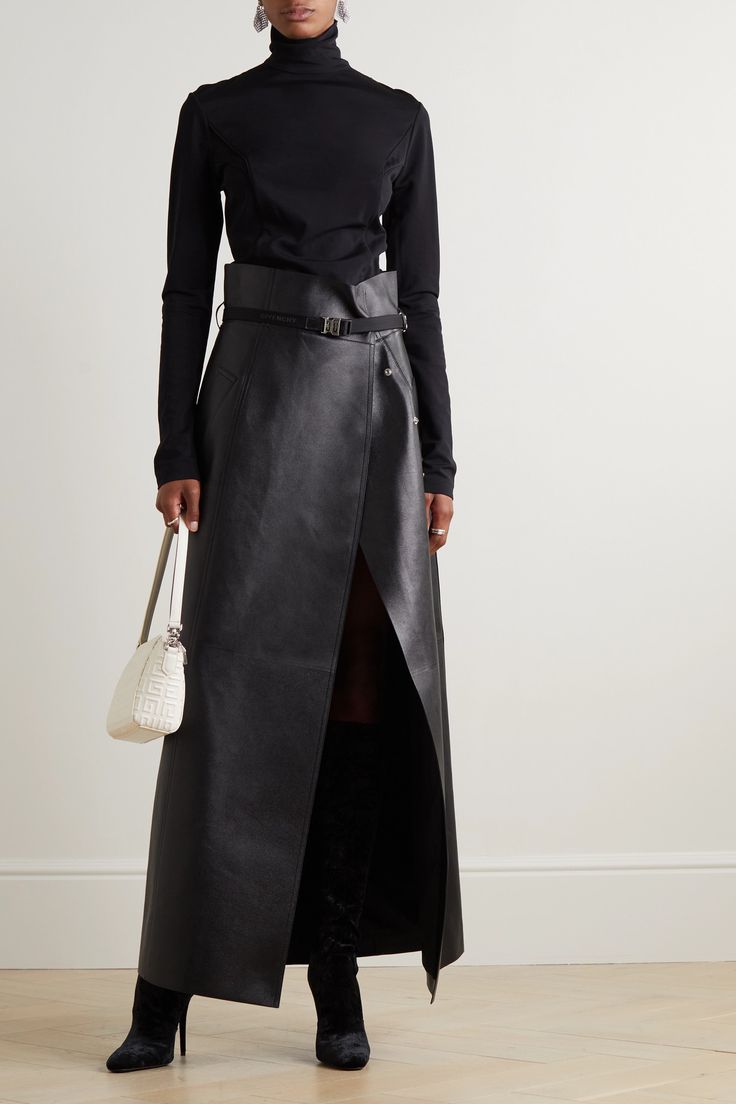 Givenchy's maxi skirt plays on extreme proportions with its floor-sweeping length and defining high waist. Debuted on the Fall '22 runway, it's made from smooth leather and cinches with a belt accented with the label's '4G' emblem. Mirror the show styling and leave the first few snap fastenings undone to create a dramatic split. Black Leather Maxi Skirt, Black Leather Maxi Skirt Outfit, Luxury Fall Evening Skirt, Luxury Evening Skirt For Fall, Black Luxury Long Skirt, Luxury Black Long Skirt, Luxury Long Black Skirt, Leather Long Skirt Outfit, Maxi Skirt Street Style