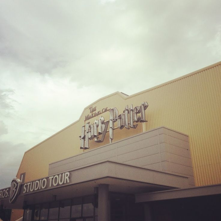 an exterior view of a harry potter movie theater with the words harry potter on it