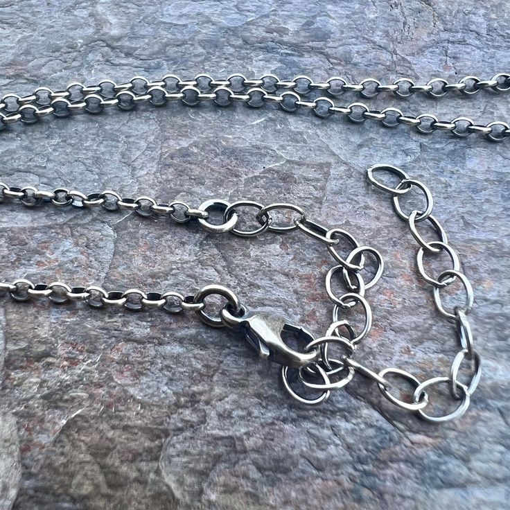 This oval cable chain is made from solid sterling silver. Each of the links on this chain measures about 2x2.5mm. This chain is light to medium in weight and will work best for pendants that are small to medium in size. The end of the chain is finished with a sterling silver lobster claw clasp and a 3-inch extender chain.The extender chain measures just under 4mm in width. The jump ring attached to the clasp can be removed and reattached with pliers to accommodate smaller pendant bails that do n Cable Chain Necklace With Oval Links Gift, Oval Link Cable Chain Necklace As A Gift, Oval Link Cable Chain Necklace For Gift, Minimalist Chain Necklace With Oval Pendant And Cable Chain, Silver Oval Cable Chain Jewelry, Minimalist Oval Link Rolo Chain Necklace, Minimalist Oval Pendant Chain Necklace With Adjustable Chain, Oval Silver Jewelry With Cable Chain, Oval Link Rolo Chain Necklace As Gift