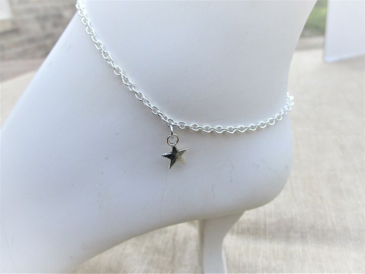 Solid Flat Star anklet.  Lead and nickel safe zinc alloy. Lobster clasp. Anklet measures 9 in but  I can make longer or shorter if needed.  All items in stock and ships from Tennessee. Free shipping Star Charm Anklets For Gifts, Star Charm Anklets Suitable As A Gift, Star Charm Anklets As Gift, Adjustable Metal Charm Bracelet With Star Charm, Adjustable Metal Anklets Nickel Free, Adjustable Silver Anklet With Lobster Clasp, Adjustable Metal Nickel-free Anklets, Star Anklet, Silver Ankle Bracelet