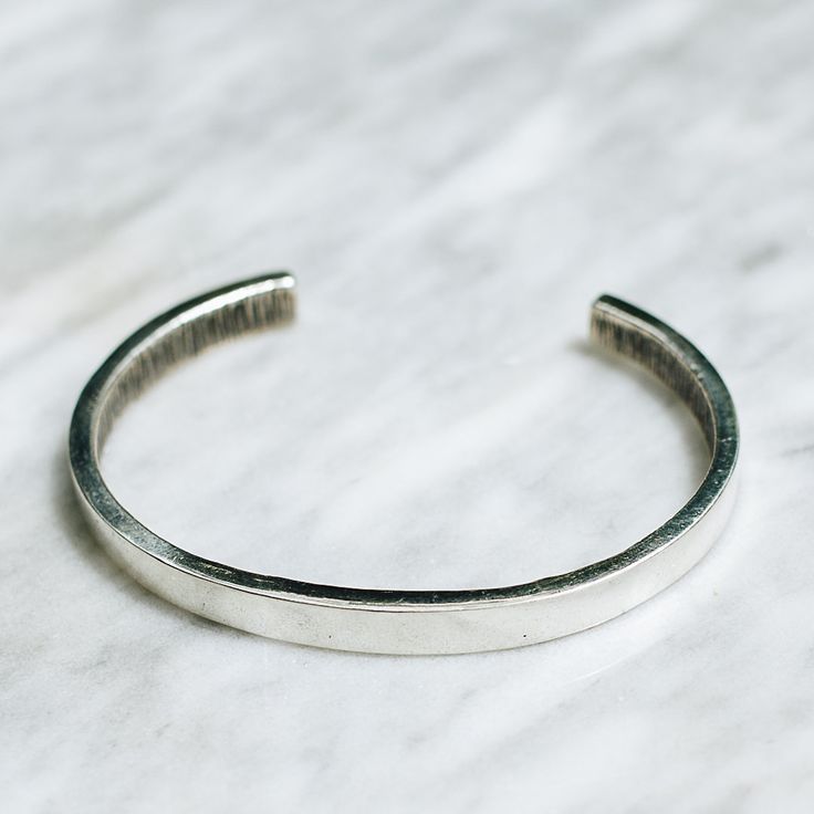 Minimalist 925 Sterling Silver cuff bracelet for men or women. A minimalistic silver cuff bracelet style adds the perfect touch dressed up or down. Available in Brass https://etsy.me/2FJXUS5 Bracelet Size Medium (Women's) Large (Men's) Every piece is handcrafted in Bali and made with Intention, Love, and Soul so that it can be felt by it's wearer and ultimately change our energy and lives in a positive way. Each with it's own story of insight and love, our pieces, like humans, are organic and as Silver Open Cuff Bracelet For Everyday, Adjustable Classic Sterling Silver Cuff Bracelet, Classic Adjustable Sterling Silver Cuff Bracelet, Everyday Silver Open Cuff Bracelet, Classic Adjustable Cuff Sterling Silver Bracelet, Minimalist Open Cuff Bracelet, Minimalist Open Cuff Bangle For Everyday, Classic Open Cuff Bangle For Everyday, Everyday Minimalist Open Cuff Bracelet