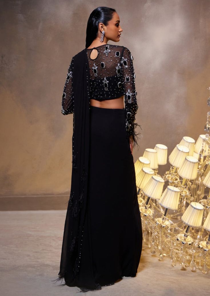 Creating a perfect harmony between the strength of the queen and the tenderness of a heart, our Diana sari set proudly affirms the inherent excellence of craftsmanship, featuring a draped silhouette and a meticulously hand-embellished blouse. Embellished Blouse, Perfect Harmony, Saree Collection, The Queen, A Heart, Saree, Queen, Black