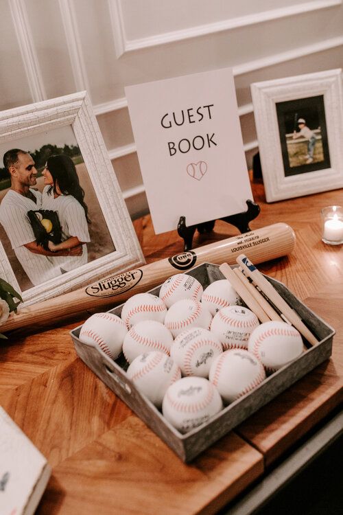 a wooden table topped with pictures and baseballs