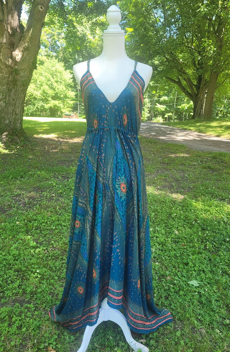 Beautiful Long Maxi Halter Bohemian Boho Chic Festival Ethnic Hippie Summer Feminine Dress. Festival Dress, Party Dress, Bohemian Dress, Ethnic Dress, Hippie Dress Trendy Dress, Boho Chic, Mandala Print Dress. You will feel so good in this gorgeous dress. Handmade  Material: Soft Rayon Size: One Size fit XS,S,M,L Length: From(under) bust to bottom in the front and back center- 29" (73.66cm) Bust: Approx. Upto 38" Hips: Approx. Upto 50" The sides are longer 45" (114.3cm) as you can see in the pho Multicolor Printed Maxi Boho Dress, Multicolor Printed Maxi Length Boho Dress, Festival V-neck Sundress Maxi Dress, Printed V-neck Boho Dress For Festivals, Hippie Floral Print Patterned Dress, Bohemian Patterned Maxi Dress With Boho Print, Multicolor V-neck Sundress For Festival, Multicolor Printed Bohemian Boho Dress, Multicolor Printed Bohemian Dress