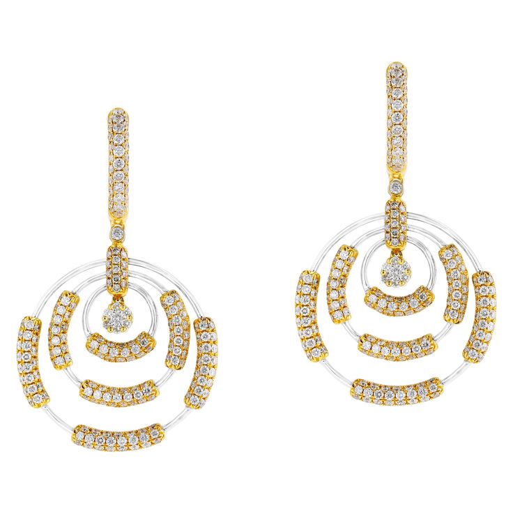 These timeless gold earrings from Amwaj Jewelry feature two round diamonds weighing 3.7 carats which form the centrepiece of the classically elegant 18 karat white gold earrings, framed by a radiant halo of yellow gold and small round white diamonds. Diamonds (Total Carat Weight: 3.7 ct) Diamond clarity: VS SI / HI Color 18 Karat White Gold Luxury White Brilliant Cut Bridal Earrings, Luxury White Diamond Cut Cluster Earrings, Luxury White Cluster Earrings With Diamond Cut, Luxury White Cluster Earrings With Diamond Accents, Luxury White Pave Set Earrings, Luxury Diamond Earrings With Halo Design For Evening, Modern Diamond White Earrings With Halo Design, Modern White Diamond Earrings For Anniversary, Luxury Halo Design Diamond Earrings For Evening