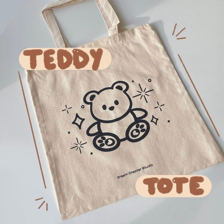 a bag with a teddy bear drawn on it and the words tote spelled out