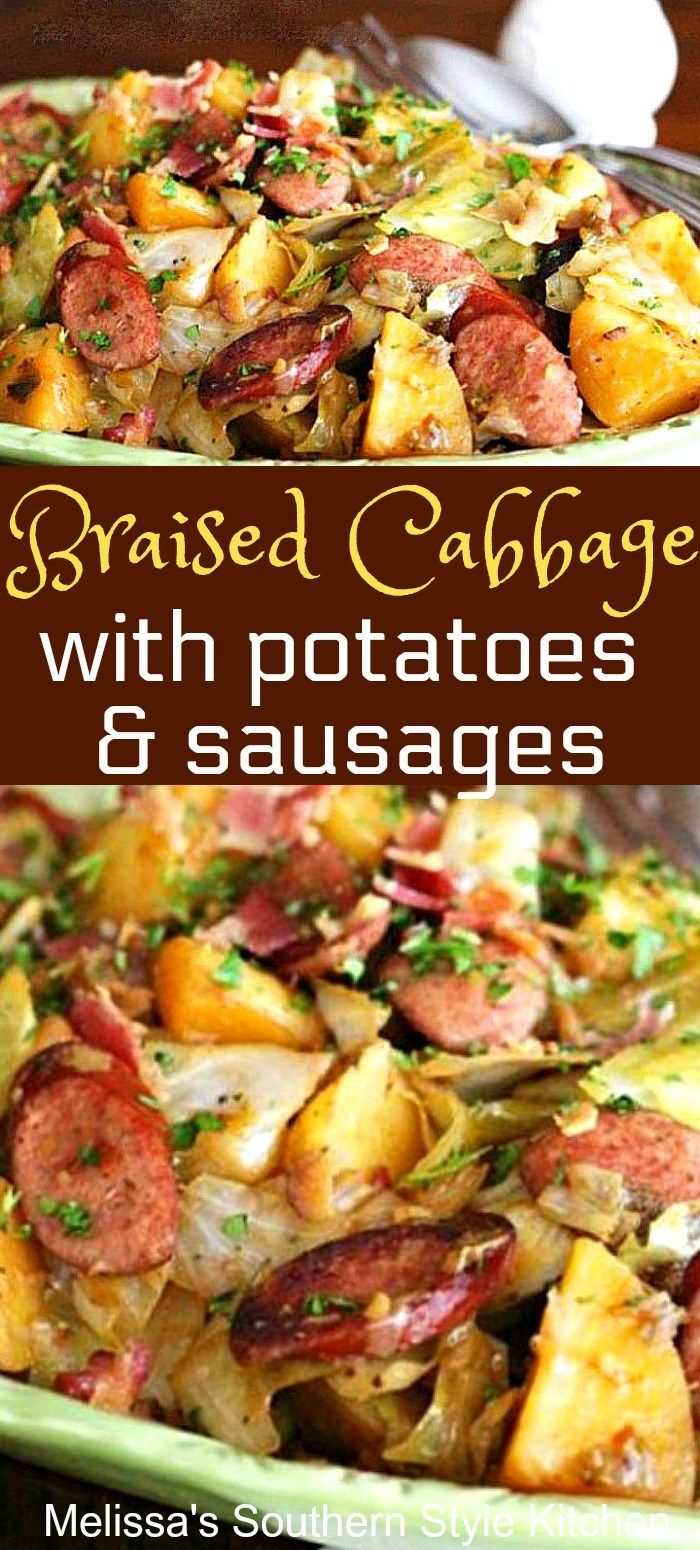 roasted cabbage with potatoes and sausages in a green casserole dish on a wooden table