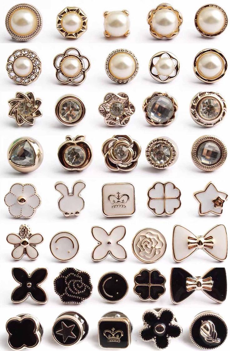 a bunch of different types of buttons on a white surface