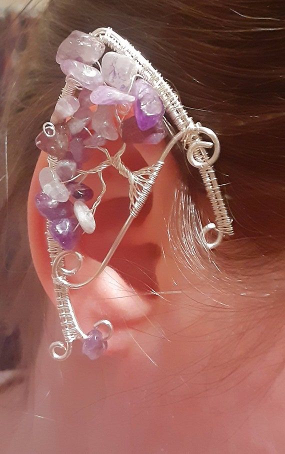 Check out this item in my Etsy shop https://www.etsy.com/listing/1145091378/treeoflifeamethystsilverplatedelfearcuff Handmade Fantasy Wrap Earrings, Adjustable Fantasy Wrap Earrings As Gift, Adjustable Fantasy Wrap Earrings For Gift, Silver Elven Earrings For Gift, Silver Elven Earrings As Gift, Elven Style Silver Earrings For Gift, Handmade Adjustable Fantasy Ear Cuff, Handmade Silver Fantasy Ear Cuff, Elven Style Silver Ear Cuff As Gift