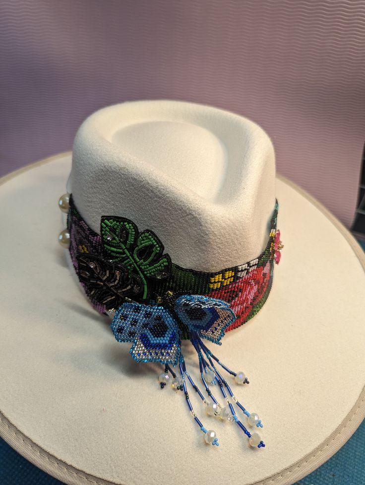 Beautiful Hand Made Shakira Beaded Hat Band with details on rhinestones and patches. *hat is not included*.  NOTE Ask for Wholesale price Multicolor Beaded Hats For Rodeo, Multicolor Beaded Hat With Curved Brim, Multicolor Beaded Brimmed Hat, Multicolor Beaded Short Brim Hat, Multicolor Bead Cap Hats For Festivals, Multicolor Bead Caps Hats For Festival, Festival Multicolor Beaded Hats, Multicolor Beaded Caps Festival Hats, Multicolor Festival Hats With Bead Caps