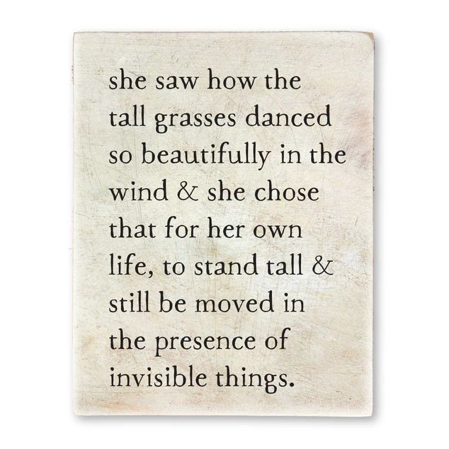 a poem written in black ink on white paper with the words she saw how the tall grasses dance so beautifully in the wind & she chose that for her own life, to stand