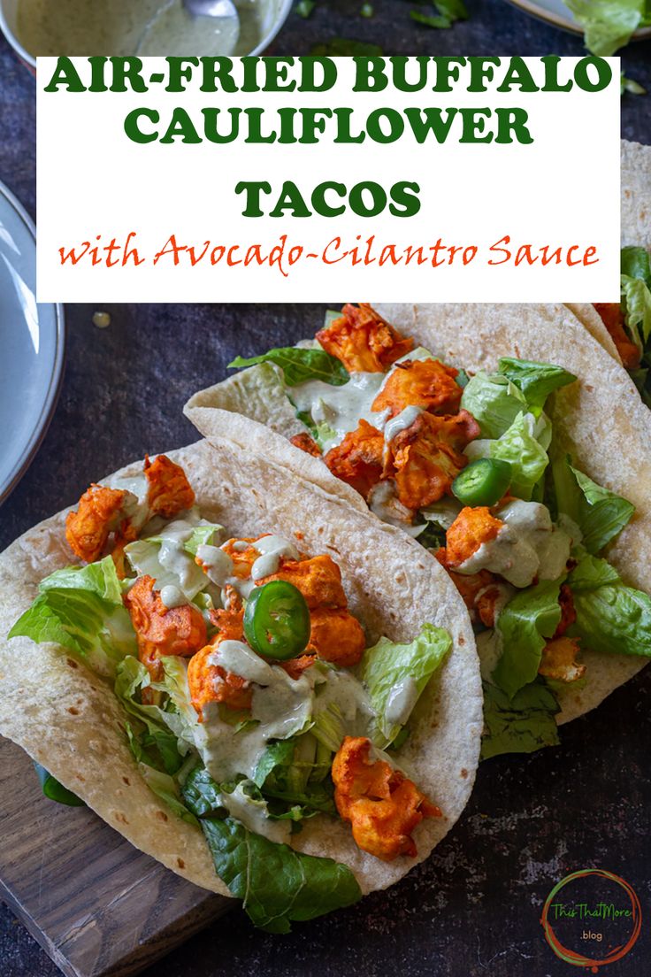 two buffalo cauliflower tacos with avocado - cilantro sauce