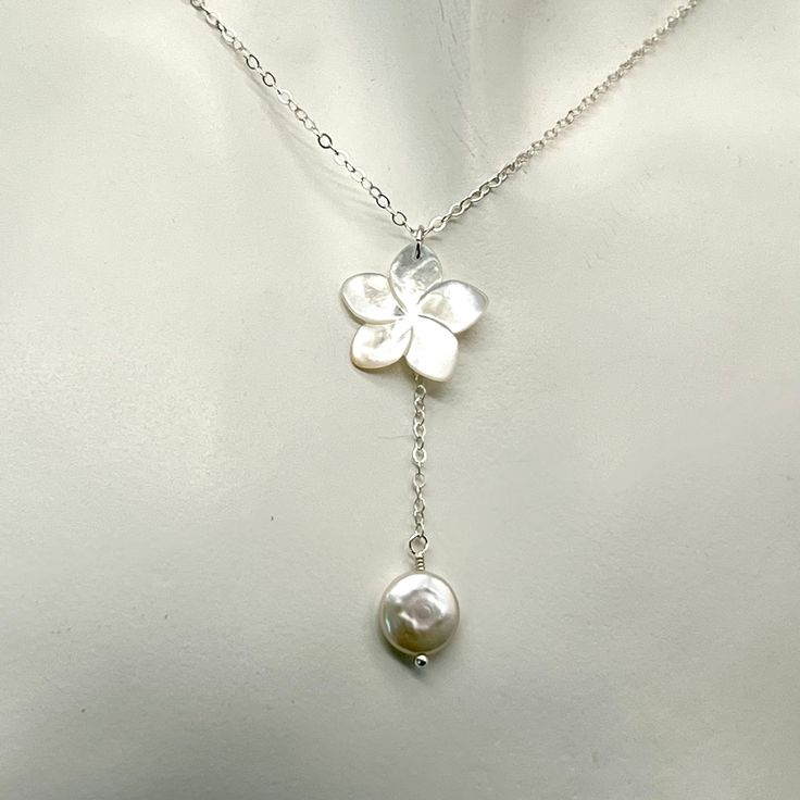 This necklace is a simple but elegant look with a lustrous carved white mother of pearl flower accented with a single iridescent freshwater coin pearl. There are beautiful tones of light pink and silver in the pearl and flower. The necklace is made with delicate sterling silver chain. It can be made in different lengths. The flower is approximately 5/8 inch in size. The chain and pearl hand down approximately 1 3/4 inches from the top of the flower to the bottom of the pearl. This length can be adjusted if needed with a message. There is a pair of matching earrings at the following link, https://www.etsy.com/listing/1381667541/white-mother-of-pearl-plumeria-earrings?click_key=0d0f10ba21be5d96335bc27968407565093661b0%3A1381667541&click_sum=ead1d502&ref=shop_home_active_1&clickFromShopCard=1 Beach Wedding Necklace, Coin Pearls, Dope Jewelry, Funky Jewelry, Jewelry Lookbook, Jewelry Inspo, Dream Jewelry, Piercing Jewelry, Pretty Jewellery