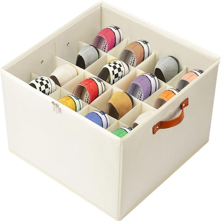 a white box filled with lots of different colored ribbons