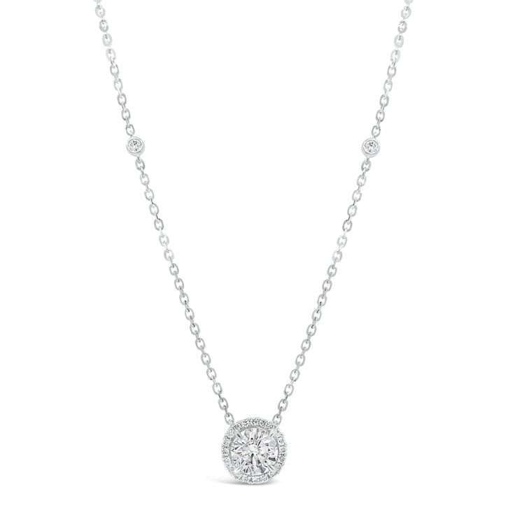 Bezel-set diamond stations and a shining halo enhance the sparkle of this stunning 1.01 ct round brilliant-cut diamond pendant. Whether worn every day or reserved for special occasions, this necklace will always feel luxurious. - 1.01 ct diamond (GIA-graded I color, I2 clarity) Center stone can be replaced for customer center stone. - 0.19 ct (total weight for all other diamonds) Available in white gold, yellow gold and rose gold. This necklace can be made with a customer center stone. Please al Round Diamond Halo, Diamond Engagement Rings Cushion, Cushion Halo Engagement Ring, Diamond Bar Necklace, Round Halo Engagement Rings, Engagement Rings Cushion, Oval Diamond Engagement Ring, Engagement Ring Diamond Cut, Round Necklace