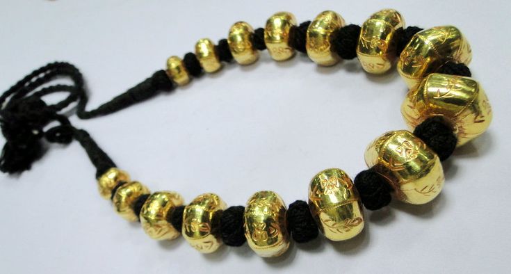 22 K gold Large beads Necklace. Handmade beautiful hollow Gold beads filled with wax inside to give more striength and durablity. Good for wear as is or for your own creation. Length-27 cm ( free size easy to adjust length by pulling the toggle), size of center bead-15/20 MM, Weight-77 grams. Material-22 K gold. Handmade Gold Temple Necklace Spiritual Style, Gold Brass Temple Necklace With Spiritual Style, Spiritual Gold Temple Necklace In Brass, Spiritual Gold Brass Temple Necklace, Gold Engraved Necklaces For Festivals, Elegant Handmade Gold Mala, Traditional Engraved Gold Necklaces, Gold Temple Jewelry Mala For Ceremonial Use, Ceremonial Gold Temple Jewelry Mala