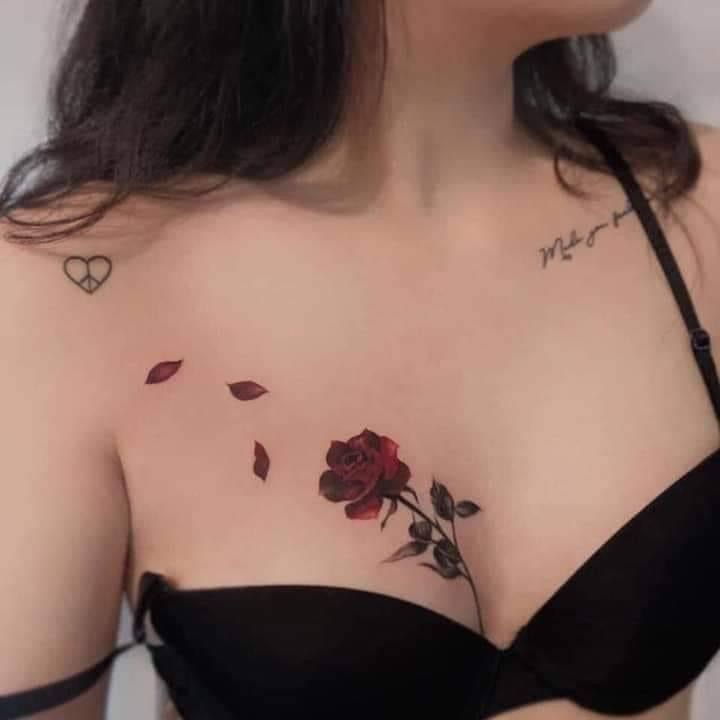 a woman with a rose tattoo on her chest