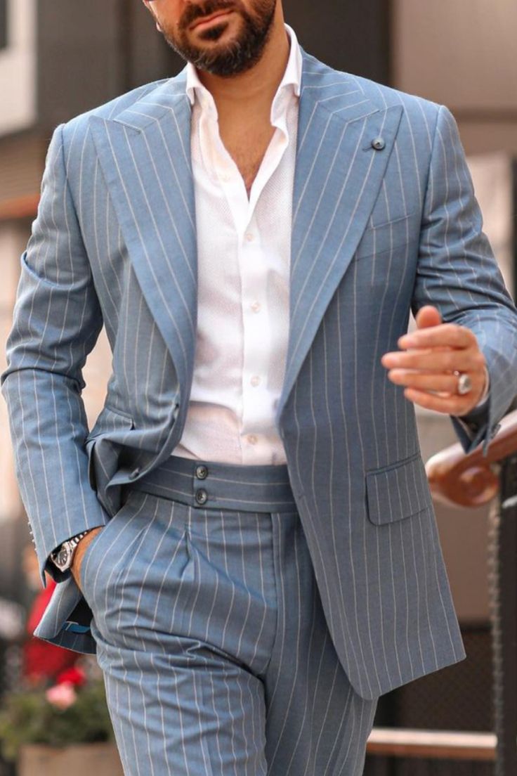 Man wearing a grey pinstripe suit! Mens Wide Peak Lapel Blazer, Sleek Suit Men, Tan Pinstripe Suit, Informal Suits For Men, Grey Striped Suit Men, Wide Lapel Suit Men, Casual Suits Men Modern Man, Stripe Suits For Men, Grey Pinstripe Suit Men