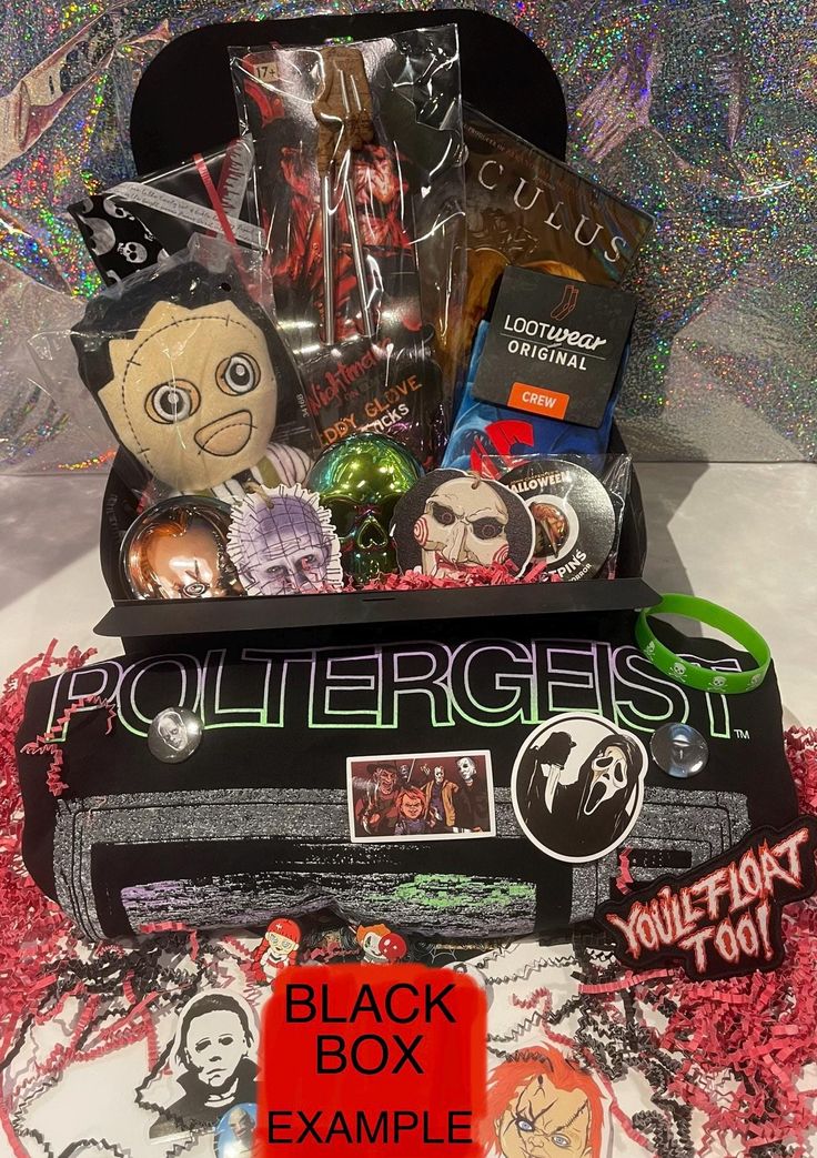 a black box filled with halloween items on top of a table