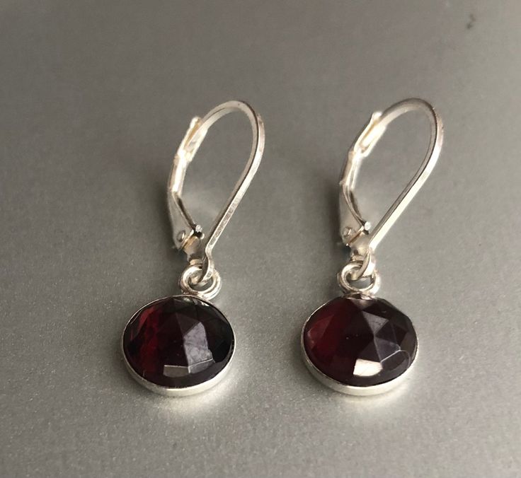 "Genuine Garnet Earrings Sterling Silver, Red Garnet Earrings Drop, January birthstone These garnet earrings will make a great gift! They made from: - Genuine faceted Mozambique red garnet 8mm cabochons set in sterling silver - Sterling silver lever back ear wires The earrings are about 1 \" long. Your order will be mailed within 2 business days nicely packaged and ready to be given. All US orders and most international orders will have tracking#. To see more of my jewelry: https://www.etsy.com/ Nickel Free Ruby Earrings As A Gift, Nickel-free Ruby Earrings As A Gift, Nickel-free Ruby Earrings For Gift, Formal Dangle Garnet Earrings, Formal Garnet Dangle Earrings, Garnet Round Earrings For Anniversary, Garnet Earrings For Anniversary, Round Garnet Earrings For Anniversary, Classic Garnet Jewelry Set With Earrings